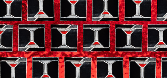 stained glass martini cocktails on a textured, red background